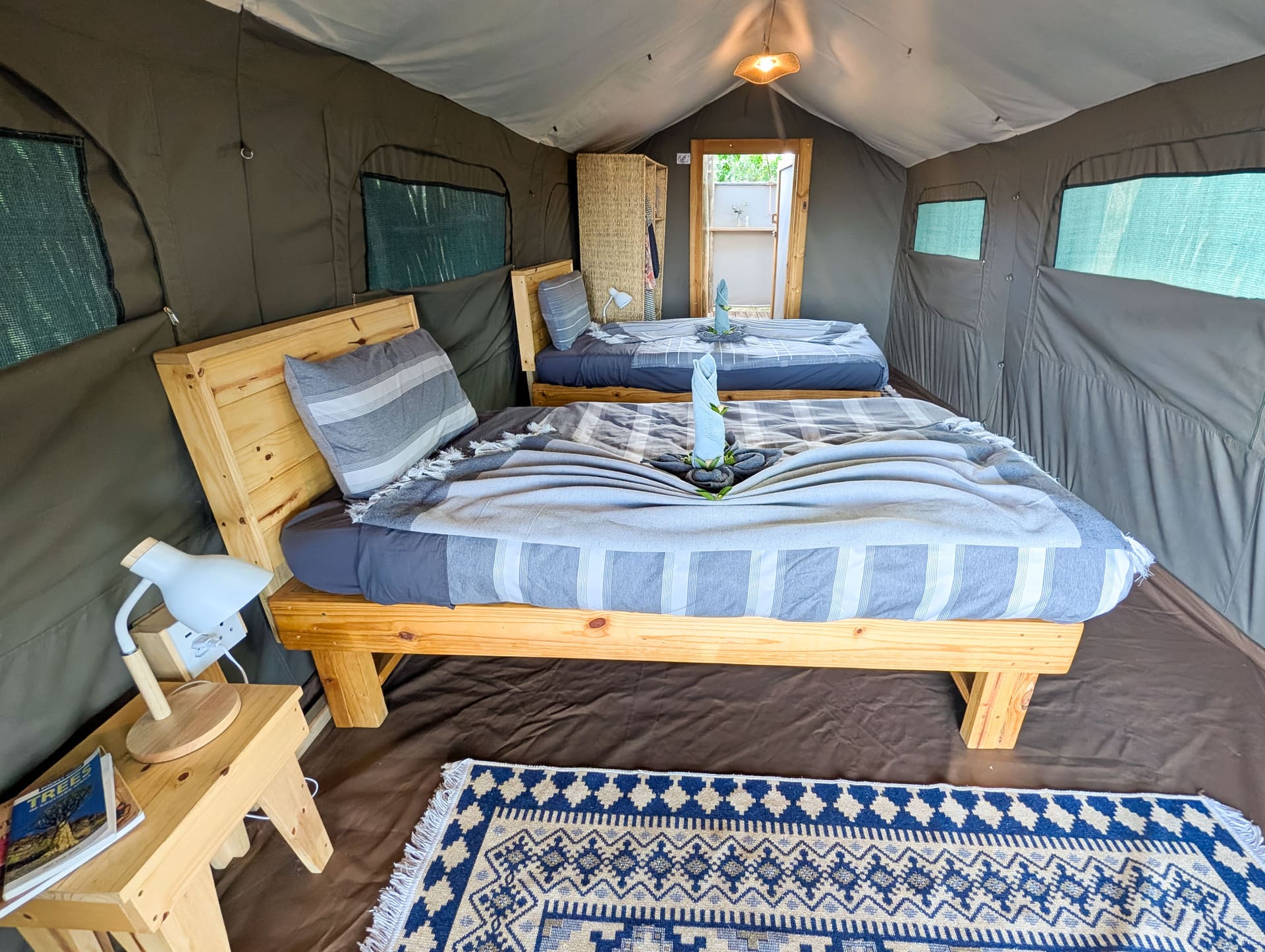 Twin beds inside a safari tent